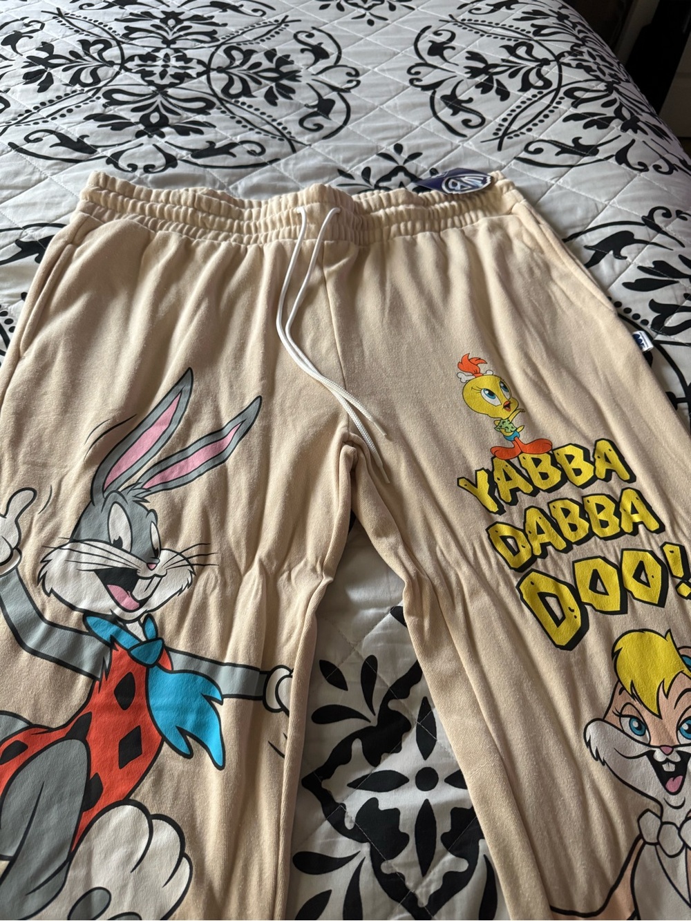 NWT. Warner Bros. Beige Cartoon Pants with Bugs Bunny